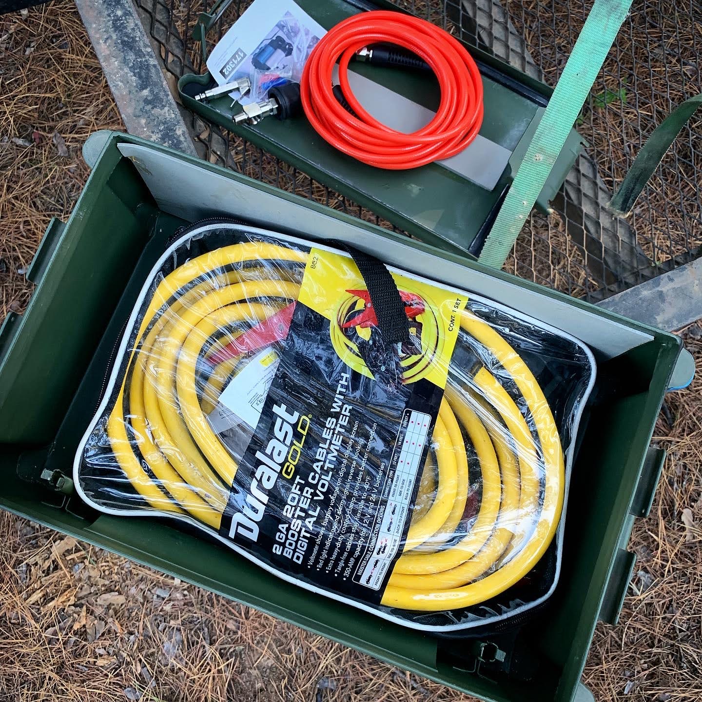 Jumper cables and other tools orderly stored in a box